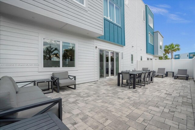 7740 Sandy Ridge Dr Unit 112, Kissimmee, FL 34747 - view of patio / terrace featuring outdoor dining area and fence