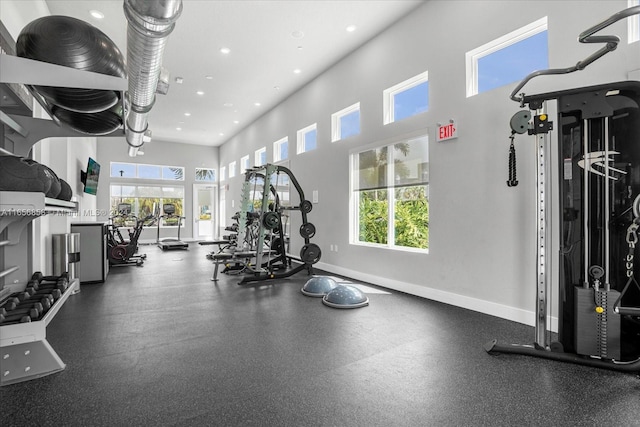 7740 Sandy Ridge Dr Unit 112, Kissimmee, FL 34747 - gym with plenty of natural light, recessed lighting, a high ceiling, and baseboards
