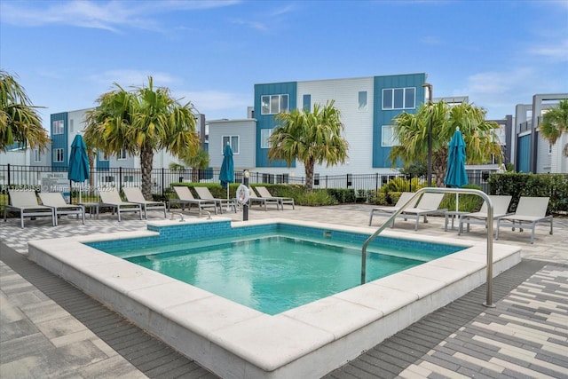 view of swimming pool with a patio area