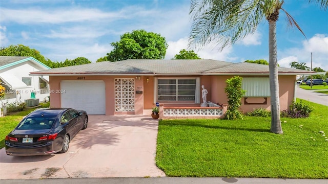 ranch-style home with central air condition unit, a porch, a front yard, and a garage