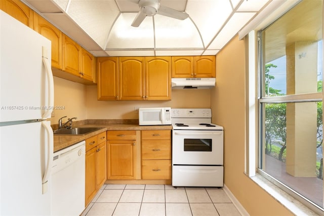 kitchen with white appliances, ceiling fan, light tile patterned floors, and sink