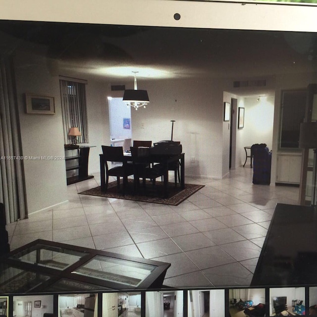 dining space featuring tile patterned flooring