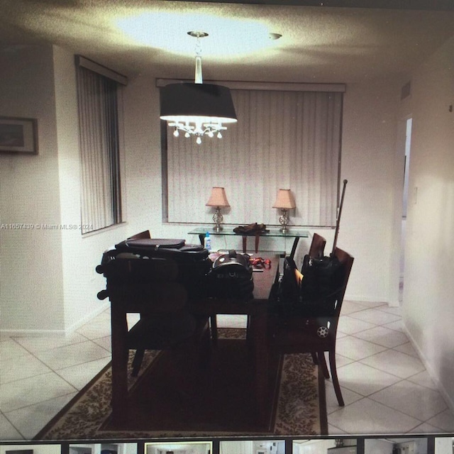 dining area with tile patterned floors