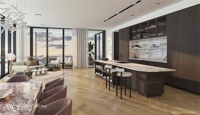 bar featuring light parquet flooring, sink, and a wall of windows