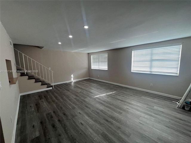 unfurnished living room featuring hardwood / wood-style flooring