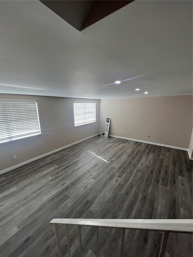 basement featuring dark hardwood / wood-style floors