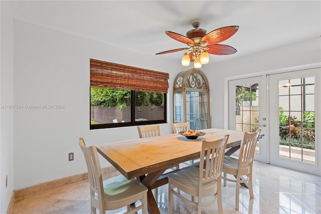 dining area with ceiling fan and french doors