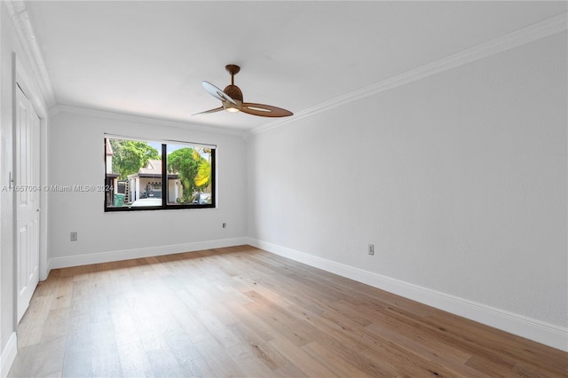 unfurnished room featuring light wood-type flooring, ceiling fan, and crown molding