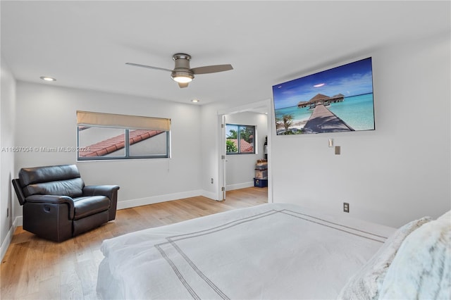 bedroom featuring ceiling fan and light hardwood / wood-style floors