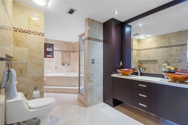 full bathroom with toilet, tile patterned floors, vanity, tile walls, and shower with separate bathtub