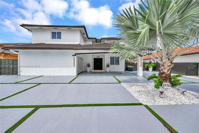 back of house featuring a garage