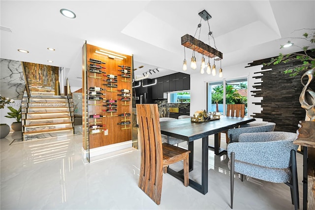 dining area with a tray ceiling