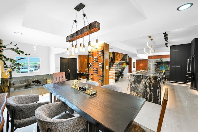 dining area featuring a tray ceiling