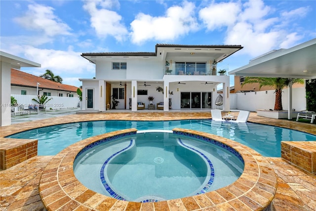 view of pool featuring ceiling fan, an in ground hot tub, and a patio