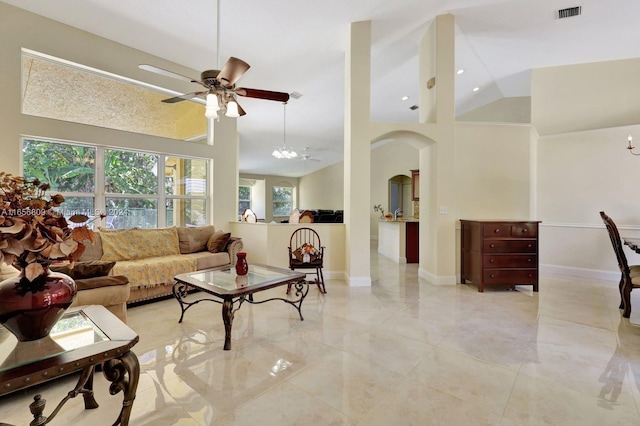 living room featuring high vaulted ceiling and ceiling fan