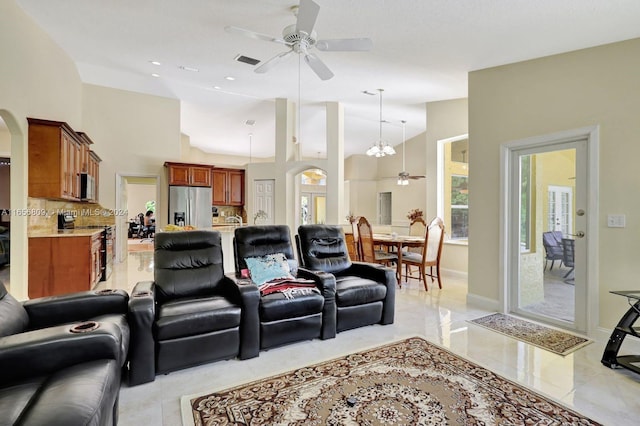 living room with lofted ceiling and ceiling fan