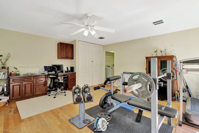 workout area with ceiling fan and light hardwood / wood-style flooring