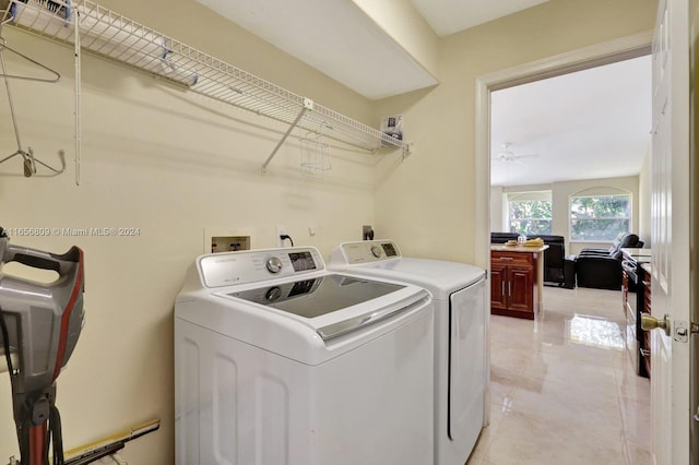 laundry room with ceiling fan, light tile patterned floors, and separate washer and dryer