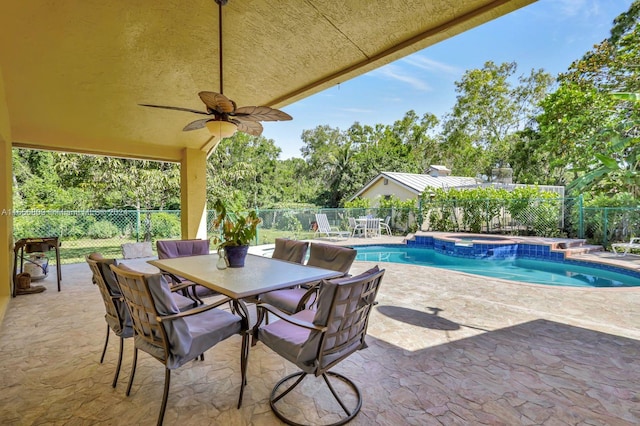 view of pool featuring a patio area, an in ground hot tub, and ceiling fan