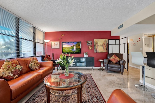 living room featuring a textured ceiling