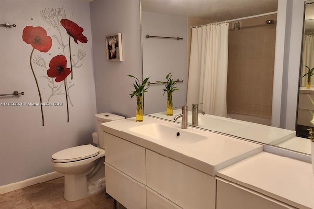 bathroom with tile patterned flooring, vanity, and toilet