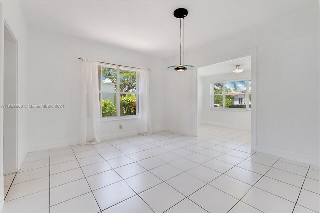 tiled empty room with plenty of natural light