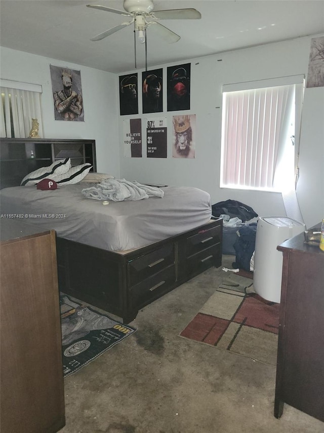 bedroom featuring concrete floors and ceiling fan