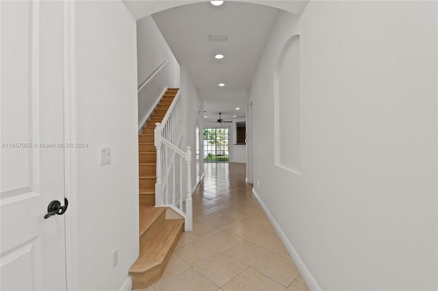 corridor with light tile patterned flooring