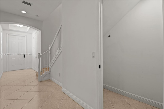 hallway with light tile patterned floors