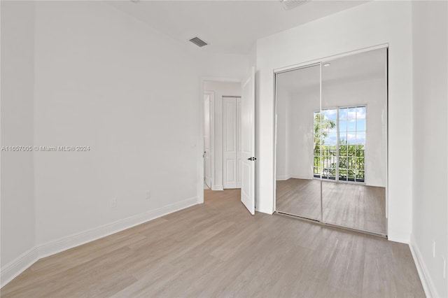 empty room with light wood-type flooring