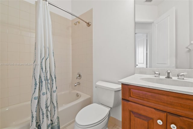 full bathroom with vanity, shower / tub combo, and toilet