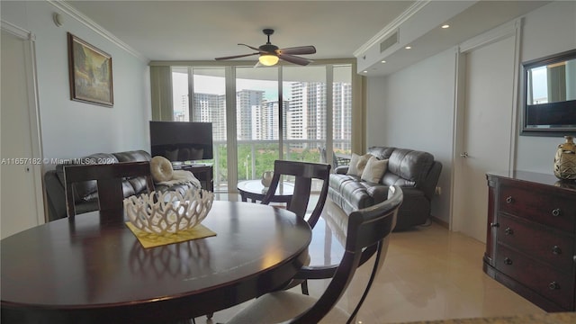 dining room with floor to ceiling windows, ceiling fan, crown molding, and a healthy amount of sunlight