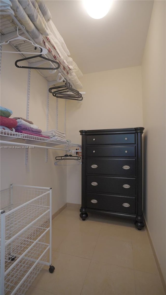 spacious closet featuring light tile patterned floors