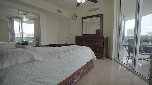 bedroom with multiple windows, ceiling fan, light tile patterned floors, and access to exterior