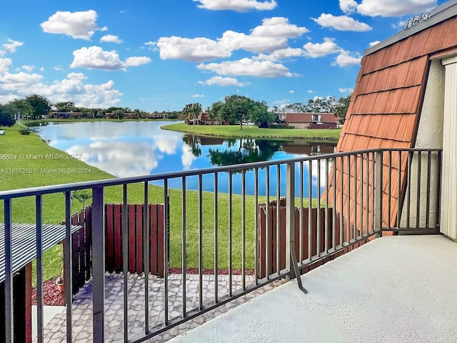 balcony featuring a water view