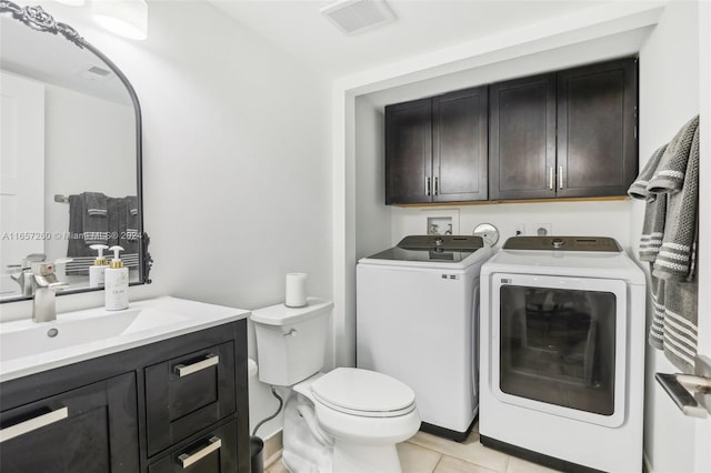 bathroom with vanity, independent washer and dryer, toilet, and tile patterned flooring