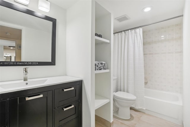 full bathroom with vanity, toilet, tile patterned floors, and shower / bath combo