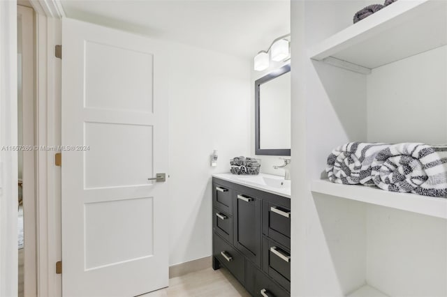 bathroom with vanity and hardwood / wood-style floors