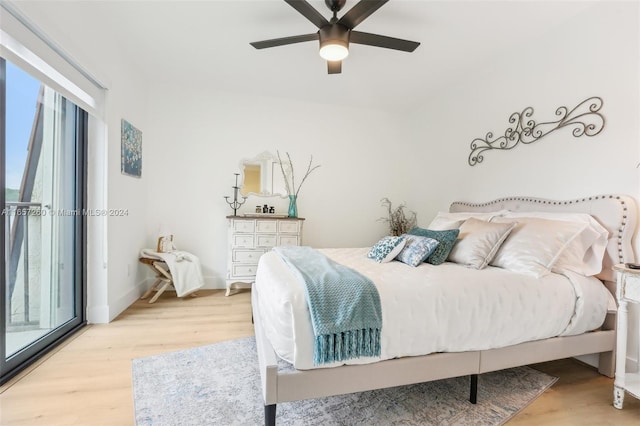 bedroom with light hardwood / wood-style flooring and ceiling fan