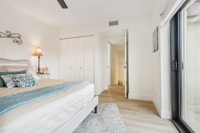 bedroom featuring a closet, ceiling fan, and light wood-type flooring