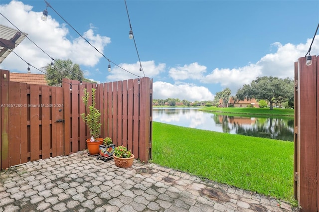 view of patio with a water view