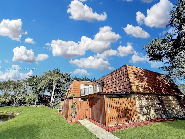 view of home's exterior with a lawn