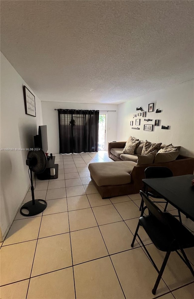 tiled living room with a textured ceiling