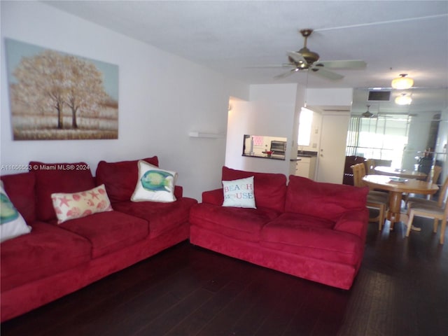 living room with hardwood / wood-style floors and ceiling fan