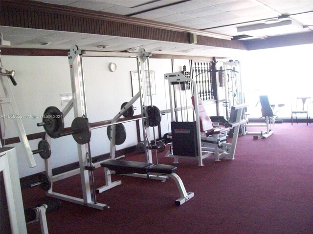 gym featuring a paneled ceiling