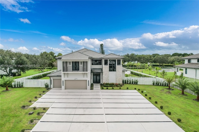 rear view of house featuring a garage and a yard