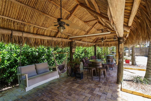 view of patio / terrace with ceiling fan, a gazebo, and an outdoor hangout area