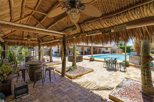 view of patio / terrace with ceiling fan and a gazebo