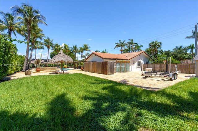 view of yard with a fire pit and a patio