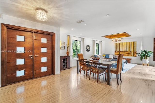 dining space with an inviting chandelier